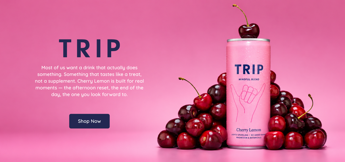 TRIP Cherry Lemon Mindful Blend can surrounded by fresh cherries on a bright pink background, with text highlighting it as a refreshing drink for everyday mindful moments.